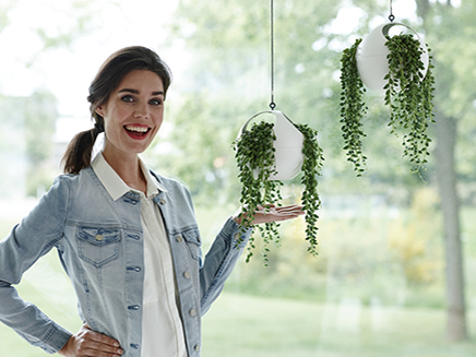 Woman with Spherical Hanging Planters