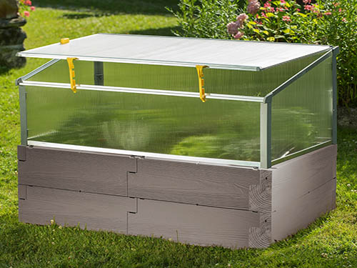 gray timber raised bed with open year round cold frame