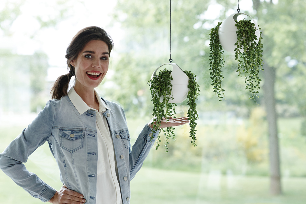 Woman with Speherical Hanging Planters