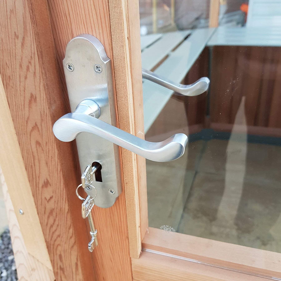 Hinged door with key in Octagonal cedar greenhouse by Alton