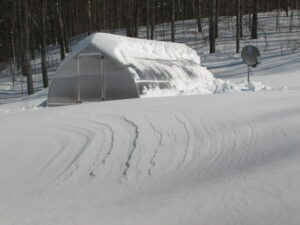 snow on polycarbonate greenhouse